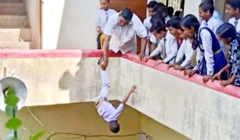 Indian principal hangs student off building upside down